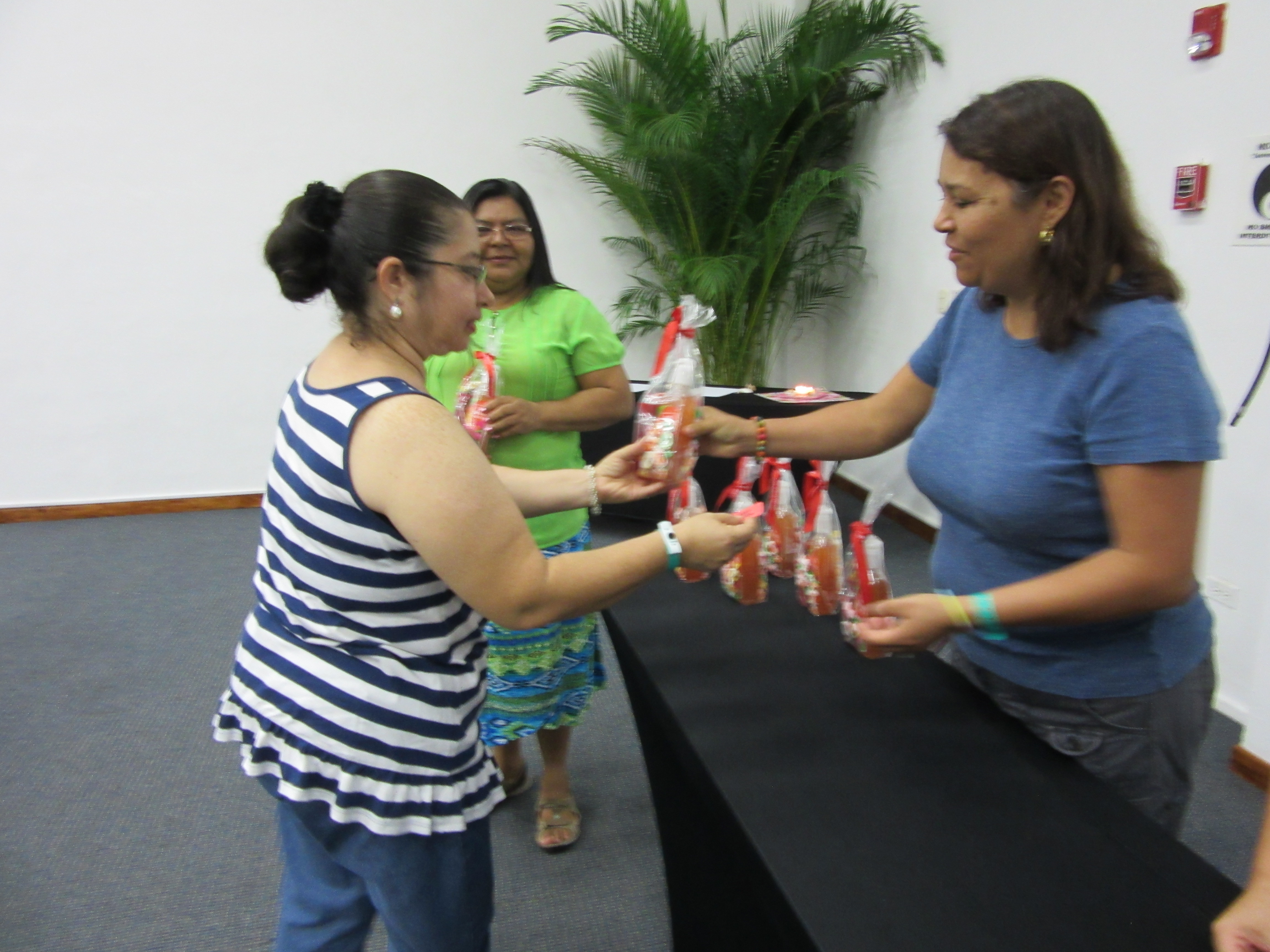 Sister Pati presenting lotions donated for raffle