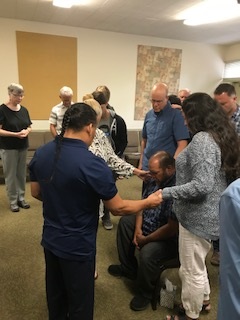 Intercessors in Santa Rosa praying over Pastor Dino Franklin, Chief of Kashia Band of PomoTribe
